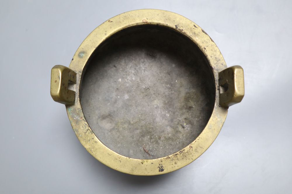 A Chinese two handled bronze censer, 16cm diameter